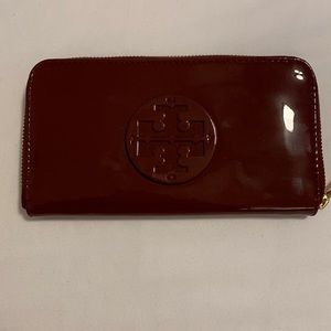 Tory Burch Stacked Patent Zip Continental Wallet in Imperial Gold.